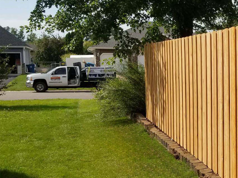 Hugo MN fence installation company truck